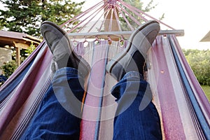 Man relaxes on the hammock photo