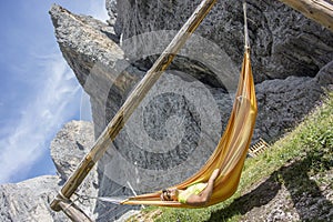 Man relaxes in the hammock