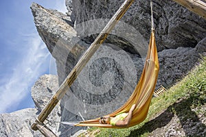 Man relaxes in the hammock photo