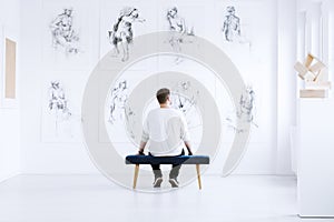 Man relaxing in art gallery