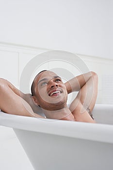 Man Relaxing In Bathtub