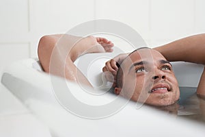 Man Relaxing In Bathtub