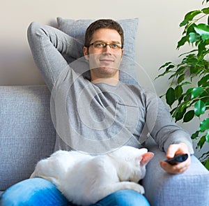 Man relaxing with cat.