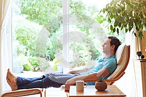 Man relaxing in deck chair at home, relaxation photo