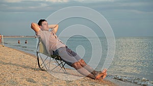 Man relaxing on deckchair