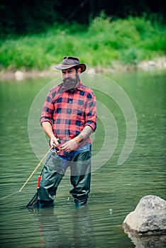Man relaxing and fishing by lakeside. Weekends made for fishing. Fisher masculine hobby. Master baiter. Keep calm and