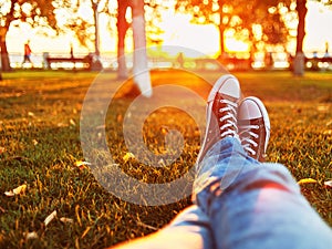 Man relaxing on a grass is sunset light