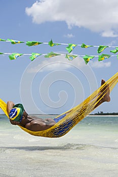 Man Relaxing in Hammock on Brazilian Beach