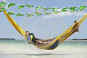 Man Relaxing in Hammock on Brazilian Beach