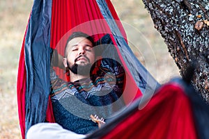 Man relaxing in a hammock