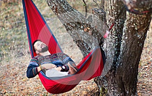 Man relaxing in a hammock