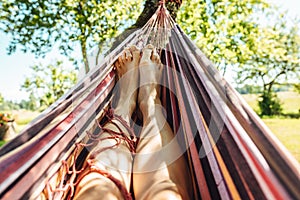 Man relaxing in the hammock on a sunny day