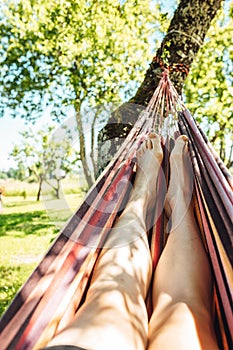 Man relaxing in the hammock on a sunny day