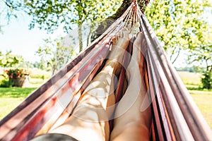 Man relaxing in the hammock on a sunny day