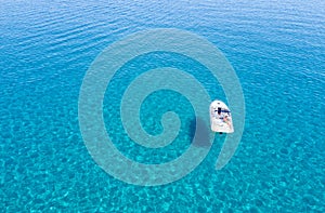Man relaxing in his boat in the aegean sea