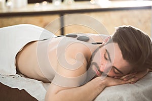 Man relaxing during lastone therapy