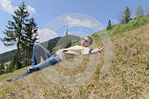 Man relaxing in the mountains