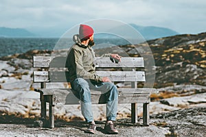 Man relaxing on Norway seaside landscape Travel Lifestyle concept