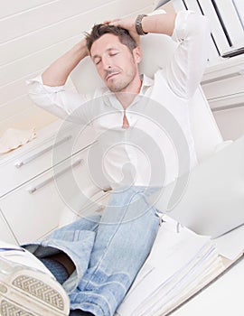 Man relaxing in office