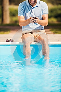 Man relaxing poolside.