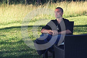 Man relaxing sitting in nature. Relaxation concept