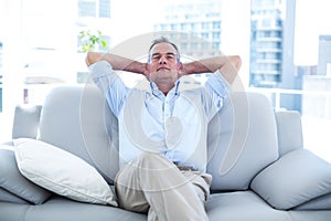 Man relaxing on sofa at home