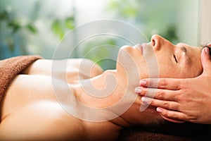 Man relaxing in spa salon