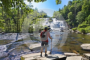 Man relaxing by the waterfall.