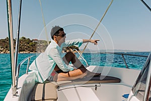 Man relaxing on yacht in the sea.