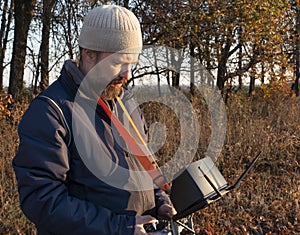 Man with Remote Control a dron in the park photo