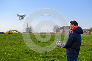 A man with a remote control in his hands. Flight control of the drone. Phantom