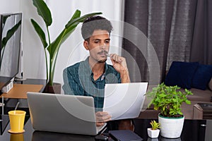Man at Remote Job. Young Nomad Travel at Teleworking Desk With Laptop