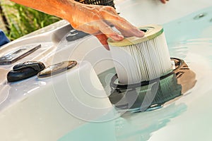 Man Removing Dirty Hot Tub Filter