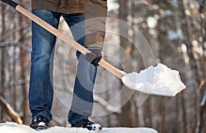 Man removing snow from a roof