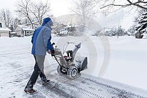Man Removing Snow with a Snow Blower #1 photo
