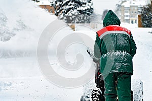 Man Removing Snow with a Snow Blower