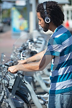 man renting city bike photo