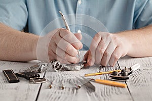 Man repaire clock photo