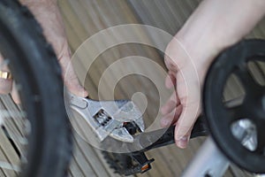 A man is repairing a bicycle