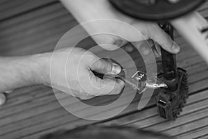 A man is repairing a bicycle