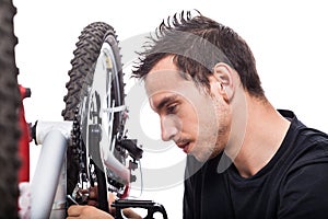 Man repairing bicycle