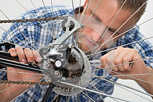 Man Repairing Bicycle