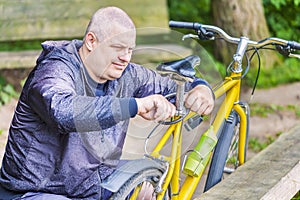 Man repairing bicycle