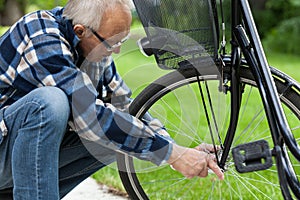 Man repairing bicycle wheel