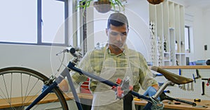 Man repairing bicycle in workshop 4k