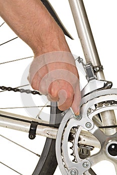 Man repairing chainring on a bicycle
