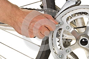 Man repairing chainring on a bicycle