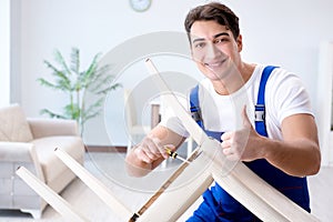 The man repairing chair in the room