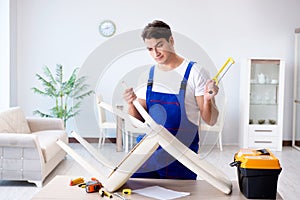 The man repairing chair in the room