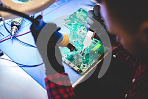 Man repairing CPU board
